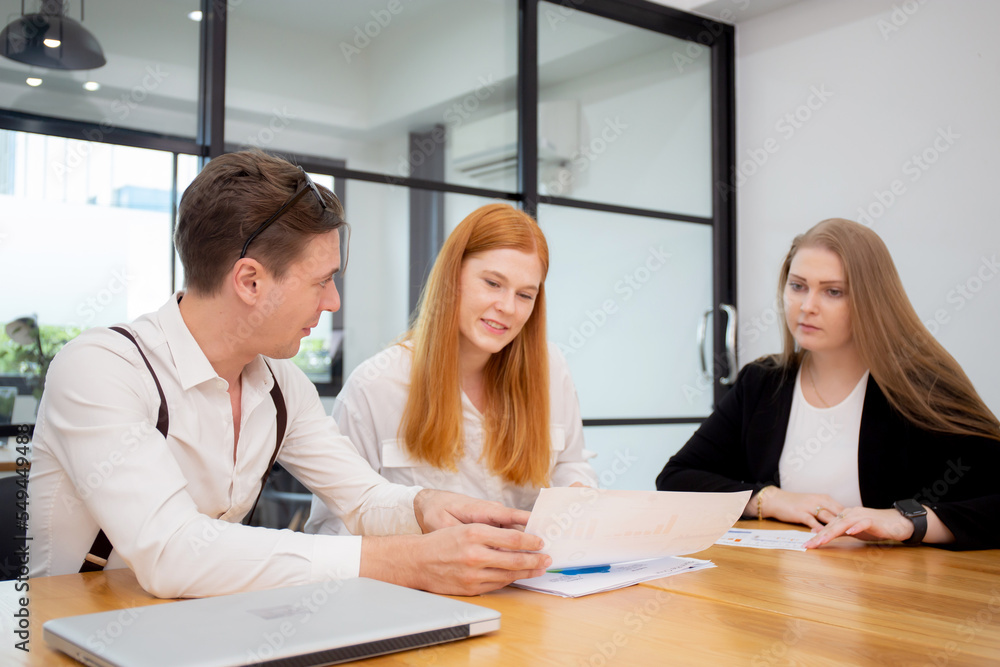 Obraz premium Group of business people meeting team for planning and strategy marketing at office, manager and partner discussing conference about finance and statistics of investment with graph and chart report.