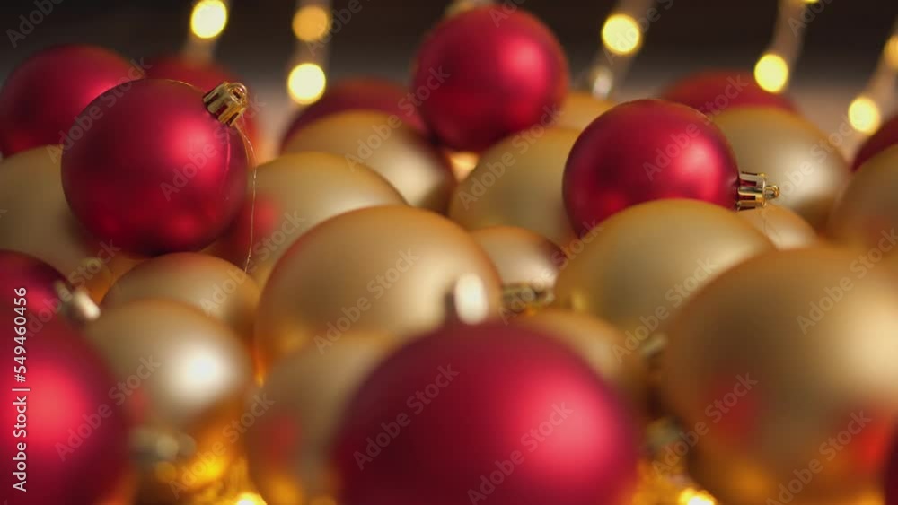 New Year's decor for a festive winter atmosphere of home comfort. Christmas balls background. Decorations Christmas tree lights. Red and gold Christmas balls. Season winter rest, vacation. Abstraction New Year's decor for a festive winter atmosphere of home comfort. Christmas balls background. Decorations Christmas tree lights. Red and gold Christmas balls. Season winter rest, vacation. Abstraction