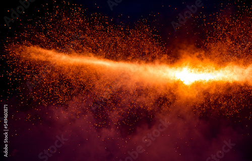 fire in the dark, explosion of ember and sparks flying on a dark background.