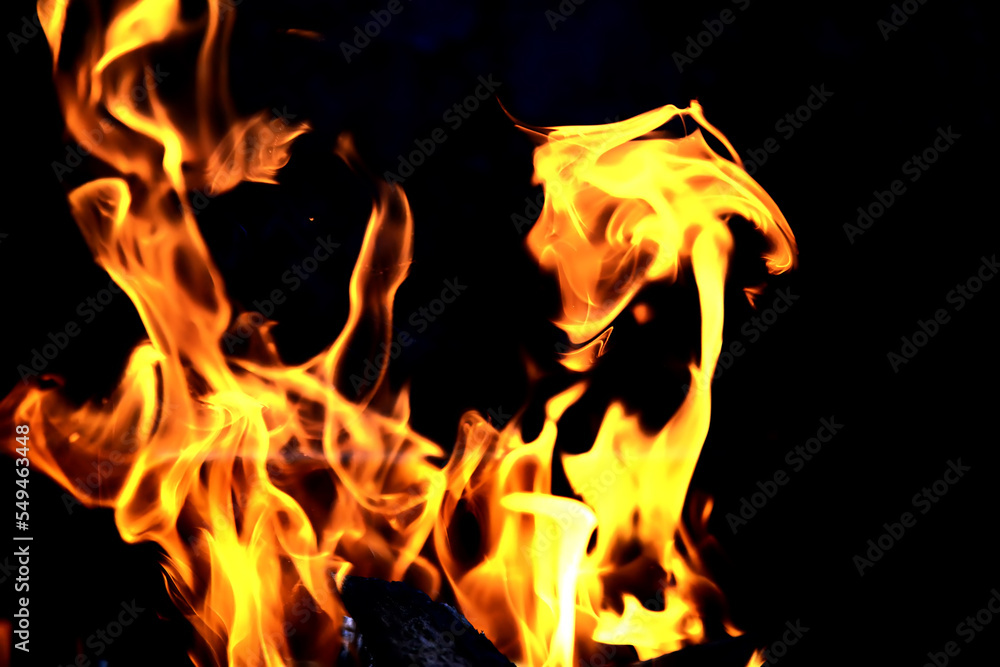 Background of the flame in the oven. Tongues of fire in a fireplace. Fire texture.
