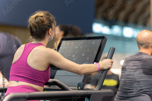 Girl Exercising in Gym in a Treadmill with Big Touch Display