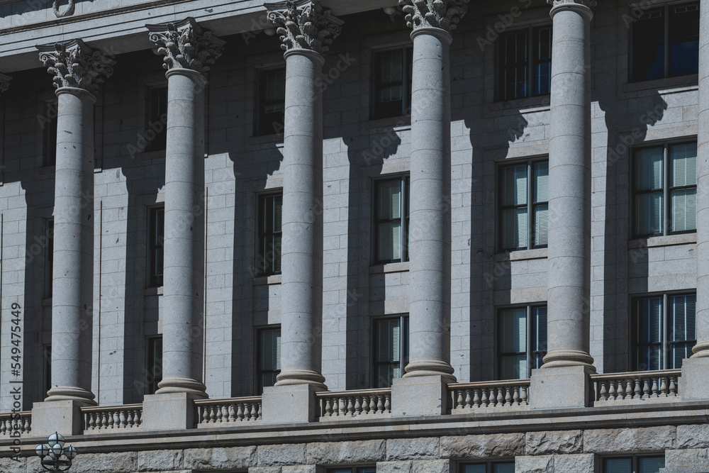 The architecture of buildings windows, stucco molding, and columns on a sunny day in the USA. High-quality photo