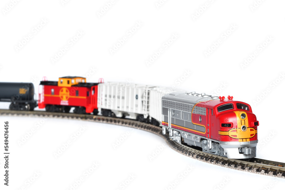 Obraz premium Scale model of a freight train isolated on white background