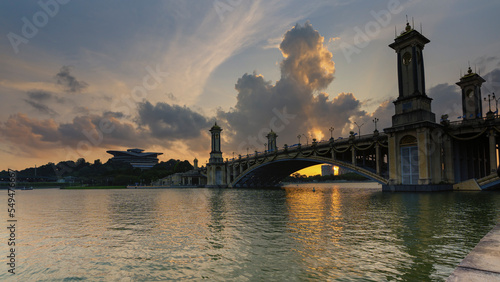 KL, MALAYSIA - Nov 18th, 2022 : image of Putrajaya International Convention Centre PICC Malaysia lake side view duuring sunset with marching clouds photo