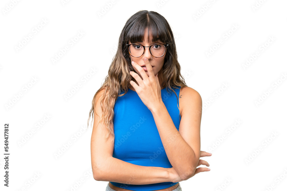 Young caucasian woman over isolated background surprised and shocked while looking right Young caucasian woman over isolated background surprised and shocked while looking right