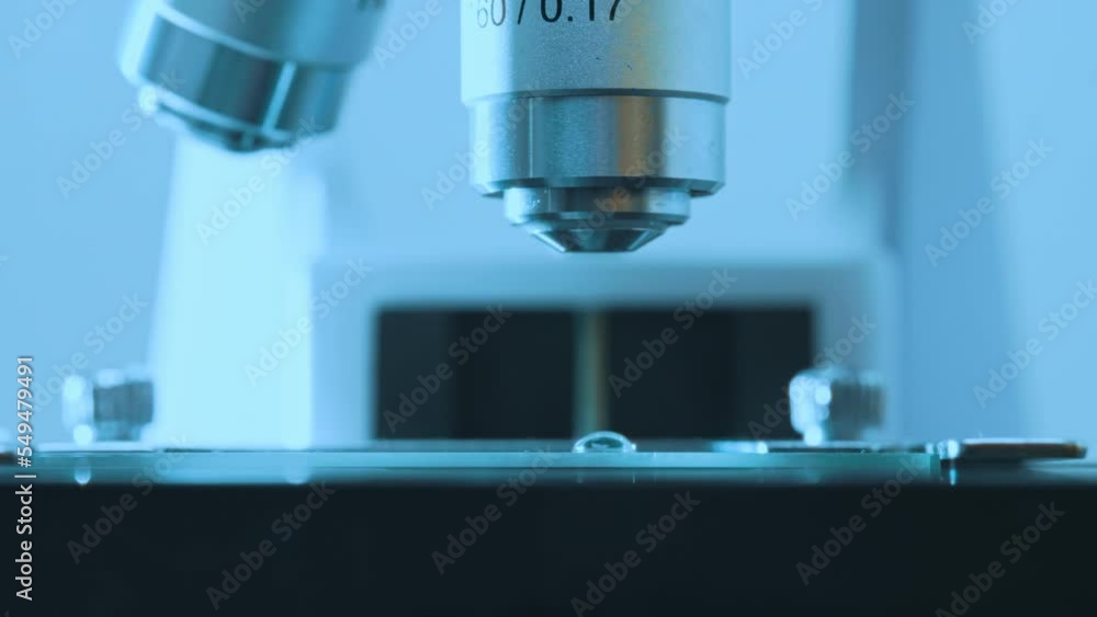 Macro view of Microscope and slide. Science and Healthcare Technology. Macro view of Microscope and slide. Science and Healthcare Technology.