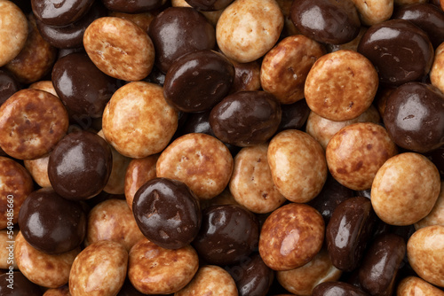 Ttraditional Dutch kruidnoten, cookies covered with chocolate and coffee icing close up full frame as background