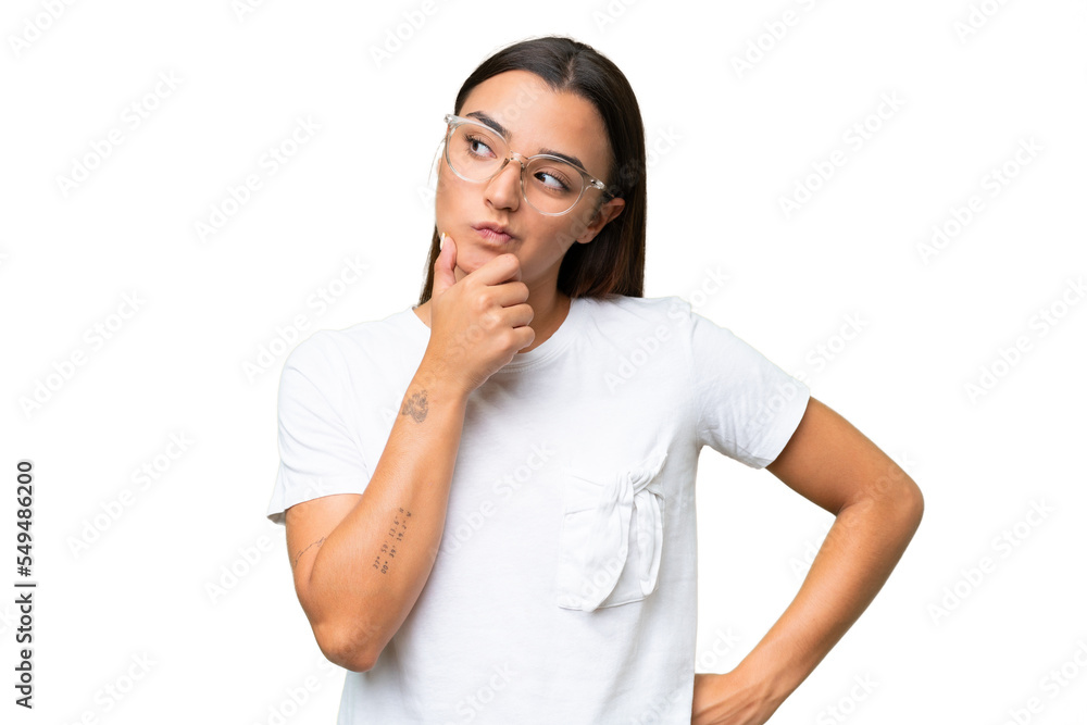 Young caucasian woman isolated on green chroma background having doubts Young caucasian woman isolated on green chroma background having doubts