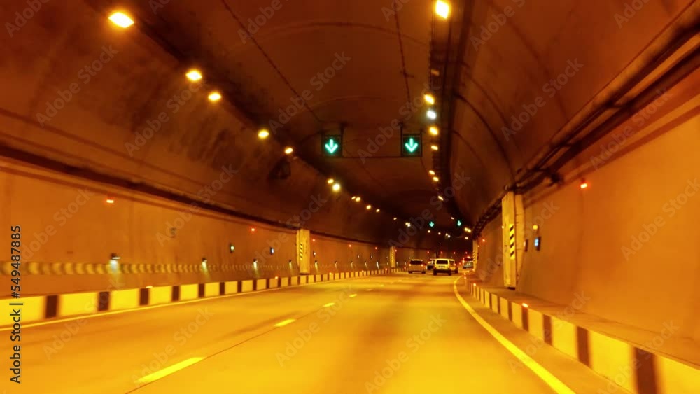 The car is moving through a car tunnel The car is moving through a car tunnel
