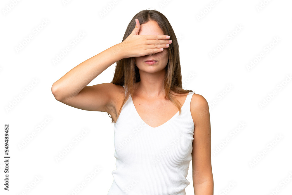 Young pretty woman over isolated background covering eyes by hands. Do not want to see something Young pretty woman over isolated background covering eyes by hands. Do not want to see something
