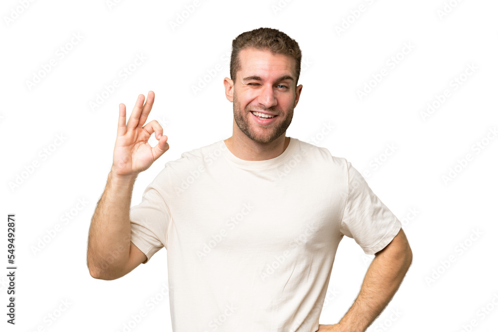 Young handsome caucasian man isolated on green chroma background showing ok sign with fingers Young handsome caucasian man isolated on green chroma background showing ok sign with fingers