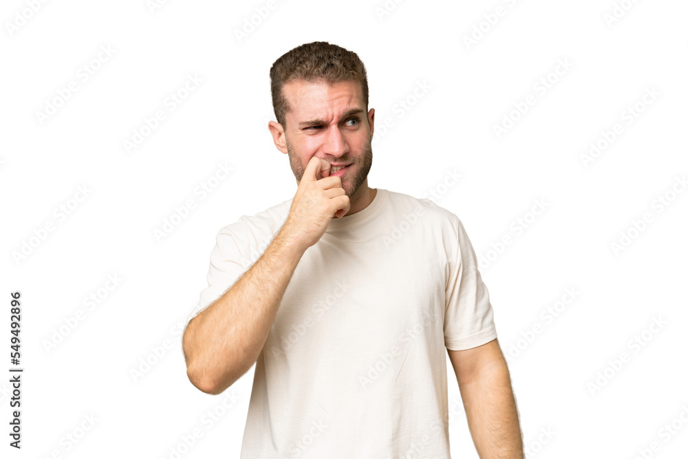 Fototapeta premium Young handsome caucasian man isolated on green chroma background nervous and scared
