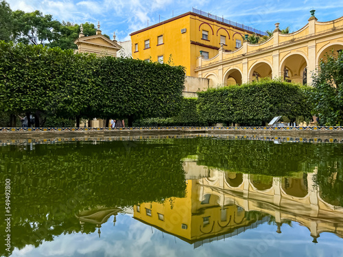 View of the Yellow building, pond with reflections Selective focus-yellow building 