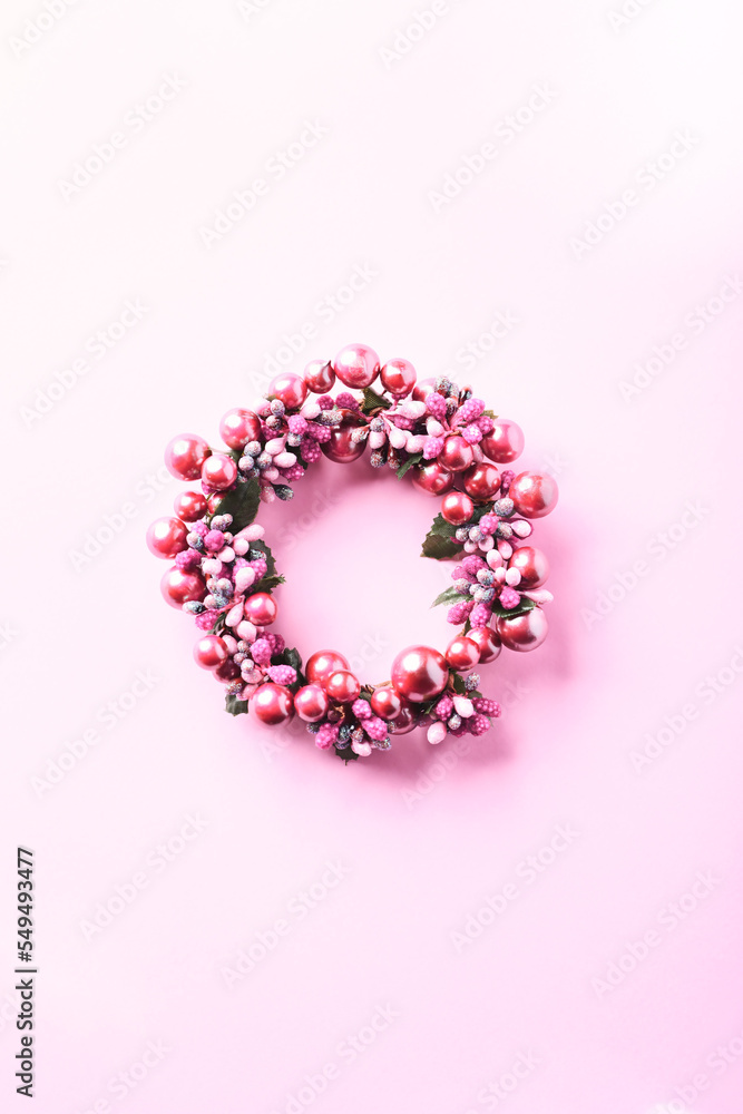 Christmas Wreath on bright paper background. Top view. Copy space.	