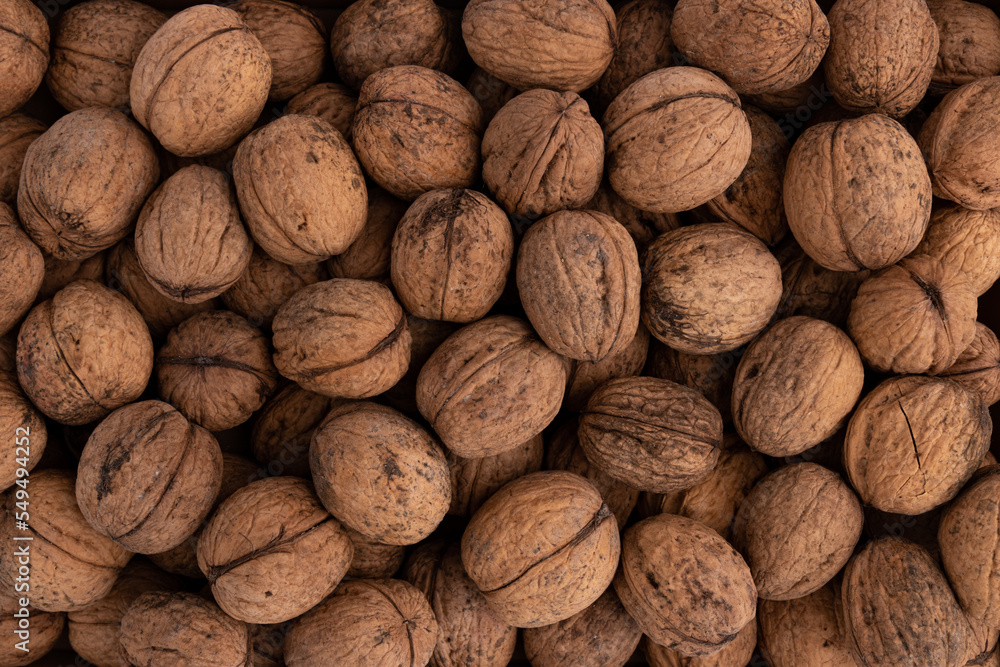 background of unpeeled walnuts close up top view background of unpeeled walnuts close up top view