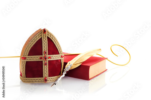 6th december Saint Nicholas Day - Sinterklaas. St Nicholas mitre and book isolated on white. photo