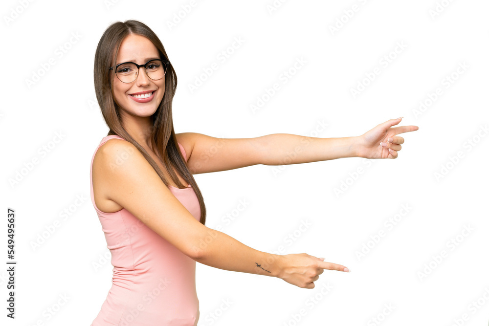 Young pretty caucasian woman over isolated background pointing finger to the side and presenting a product Young pretty caucasian woman over isolated background pointing finger to the side and presenting a product