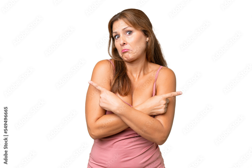 Middle-aged caucasian woman over isolated background pointing to the laterals having doubts Middle-aged caucasian woman over isolated background pointing to the laterals having doubts