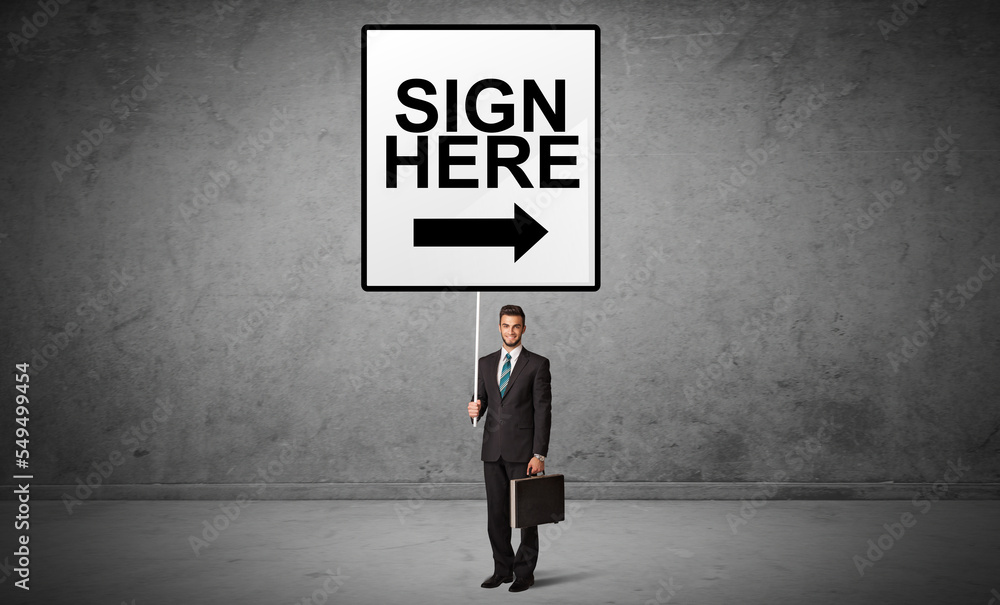 business person holding a traffic sign business person holding a traffic sign