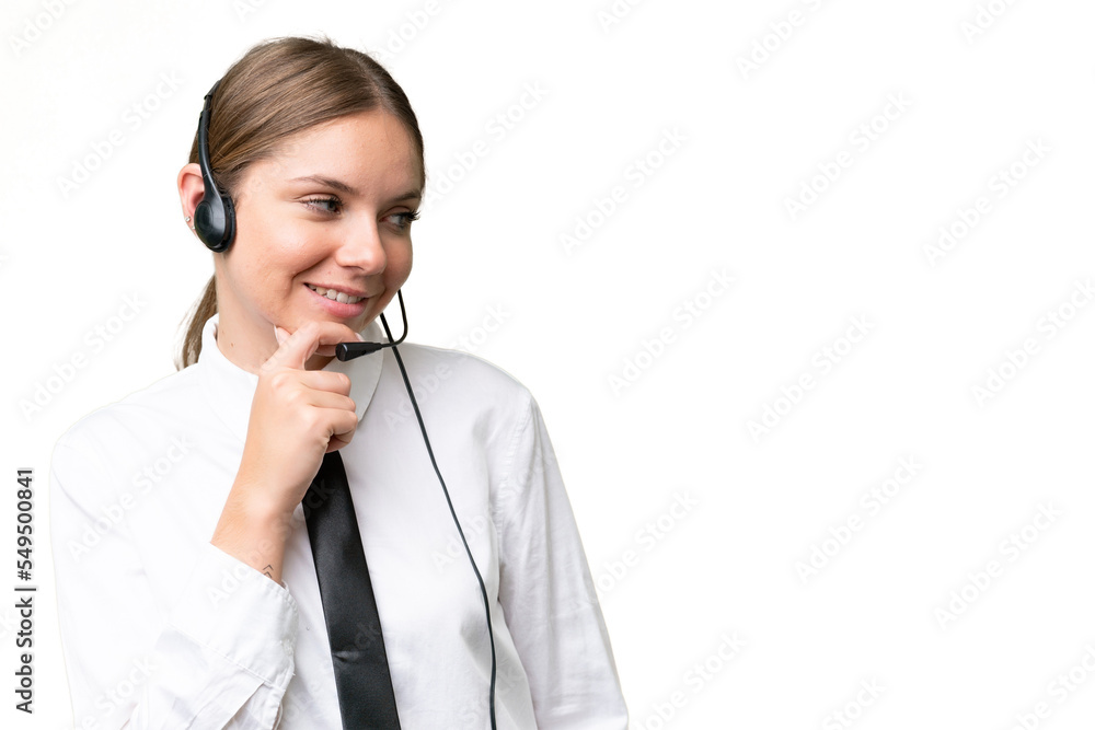 Telemarketer caucasian woman working with a headset over isolated background thinking an idea and looking side Telemarketer caucasian woman working with a headset over isolated background thinking an idea and looking side