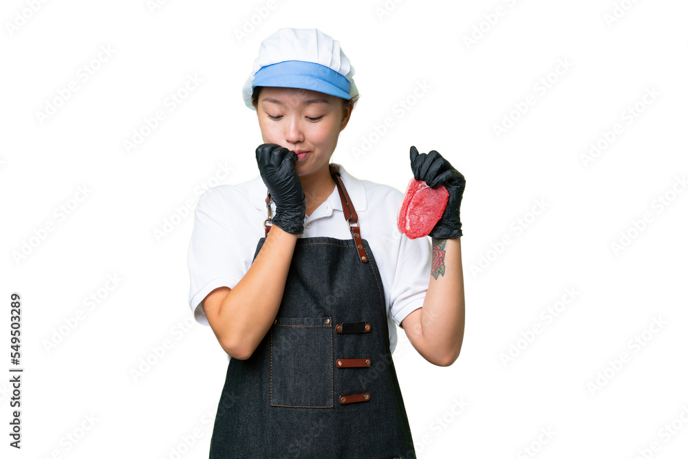 Young caucasian woman wearing an apron and serving fresh cut meat over isolated background having doubts Young caucasian woman wearing an apron and serving fresh cut meat over isolated background having doubts