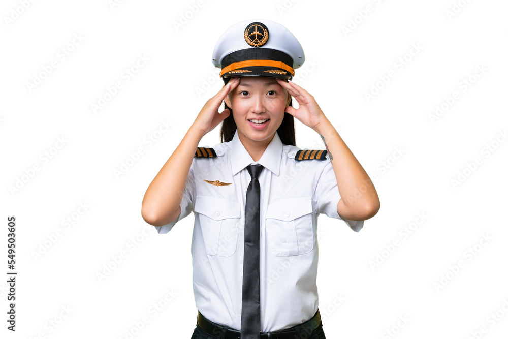 Airplane pilot Asian woman over isolated background with surprise expression Airplane pilot Asian woman over isolated background with surprise expression