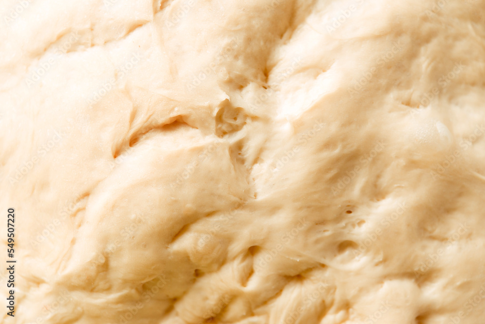 Process of raising the dough. Dough made from natural sourdough. Wheat dough. Fermentation. Top view. Process of raising the dough. Dough made from natural sourdough. Wheat dough. Fermentation. Top view.