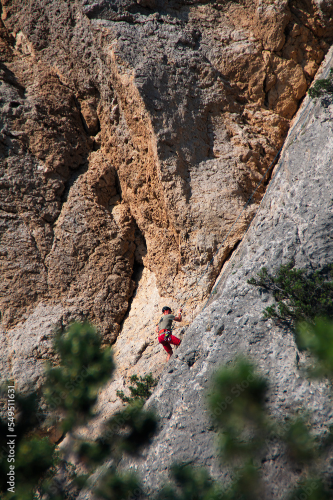 rock climber on a rope in the mountains rock climber on a rope in the mountains