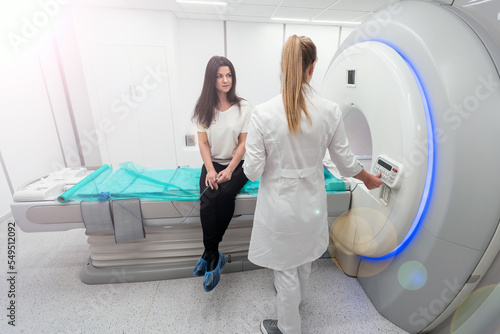 Female patient undergoing MRI - Magnetic resonance imaging in Hospital. Medical Equipment and Health Care