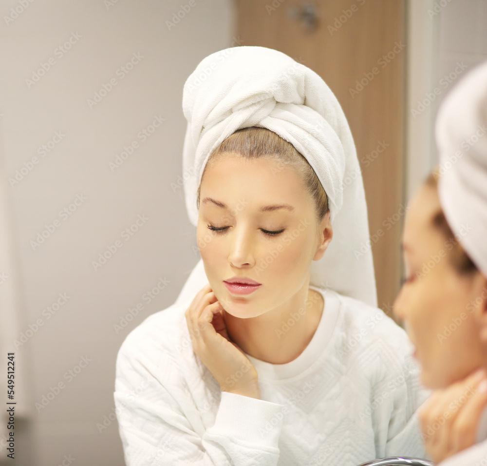 Woman looking in the mirror Applying the cream..Magic anti-aging cream... Woman looking in the mirror Applying the cream..Magic anti-aging cream...