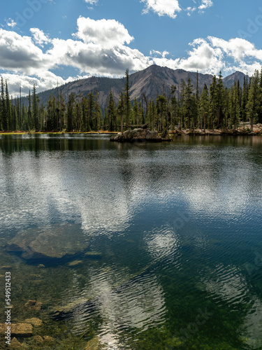 Idaho wilderness lake in midafternoon with cloud reflection