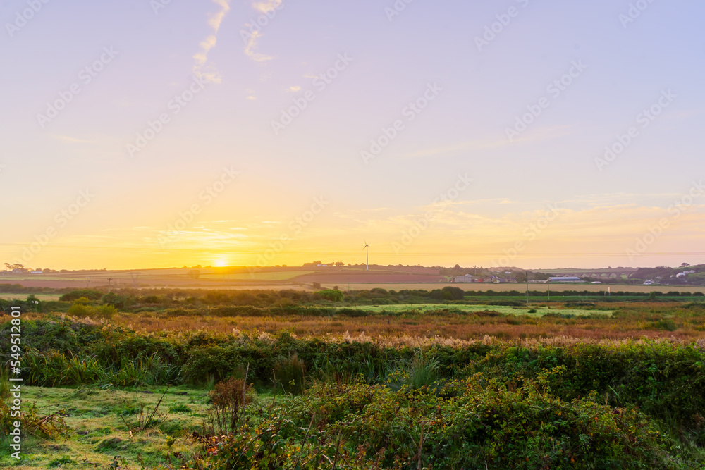 Sunrise over a countryside landscape, in Cornwall