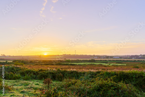 Sunrise over a countryside landscape, in Cornwall