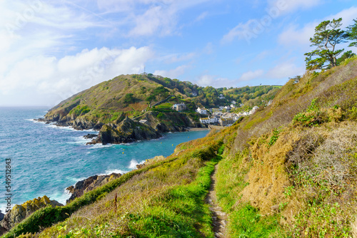 Cliffs along the coastline, and of the village Polperro photo