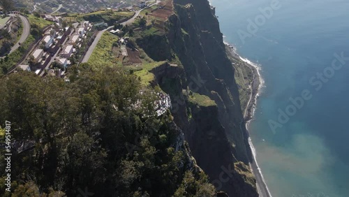 Orbit drone view of Cabo Girao. The tallest viewpoint to the ocean in Europe. Amazing huge cliff showing the blue sea. Located in Madeira, Portugal.