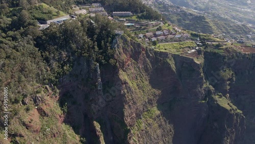 Orbit drone view of Cabo Girao. The tallest viewpoint to the ocean in Europe. Amazing huge cliff with the villages in the background. Located in Madeira, Portugal.