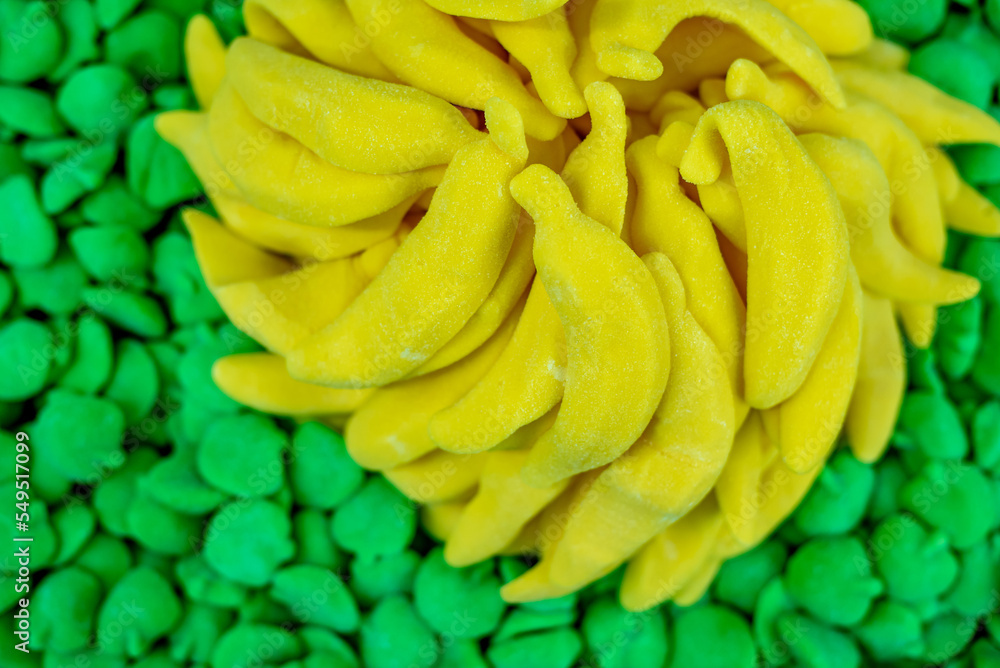 many colored marmalade candies laid out on a flat surface; dessert for the holiday; sweet gifts for children; texture and background with small candies many colored marmalade candies laid out on a flat surface; dessert for the holiday; sweet gifts for children; texture and background with small candies