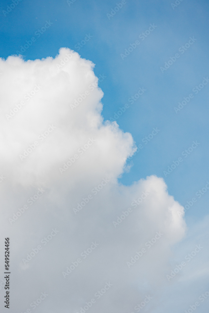 white cumulus clouds against a blue sky, beautiful large thunderclouds in the sky. background of nature. freedom and flight above the earth among the clouds, a dream and a desire. place for