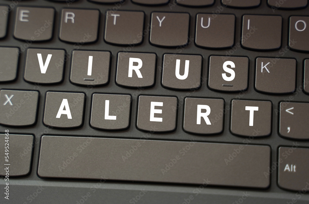 On the black keyboard, the inscription is highlighted in white - Virus alert On the black keyboard, the inscription is highlighted in white - Virus alert