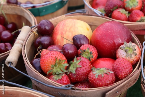 Closeup of a mixed fruit basket at a farmer's market