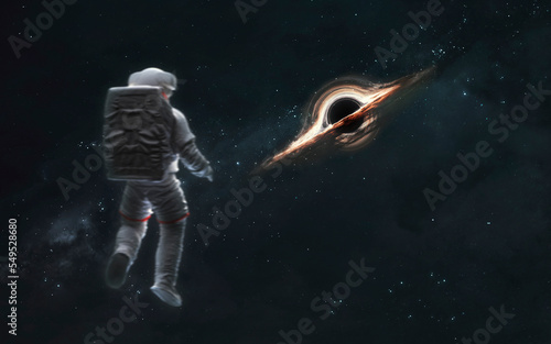 3D illustration of astronaut looking at black hole. 5K realistic science fiction art. Elements of image provided by Nasa