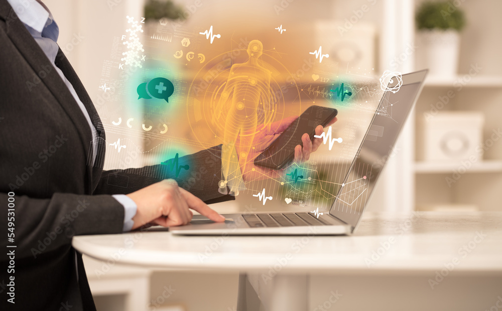 Doctor working on laptop with healthcare concept Doctor working on laptop with healthcare concept
