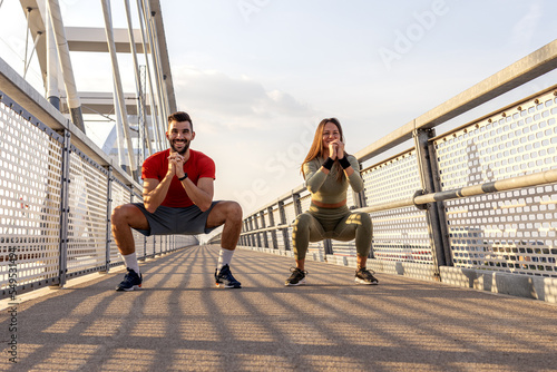 Couple young man and woman in sportswear exercise and run outside