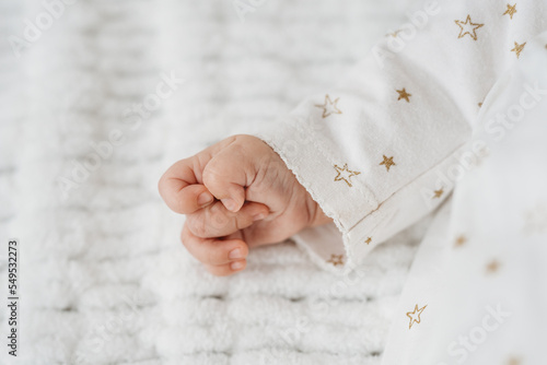 tiny newborn baby hand close up detail 