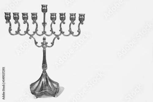 Beautiful silver hanukkah menorah. Ancient ritual candle menorah on a white background photo