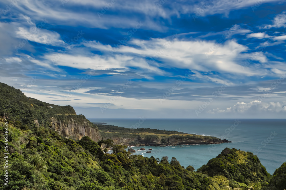 Coastal scenery with rainforest and steep cliffs along the Coastal scenery with rainforest and steep cliffs along the Tasman Sea, West Coast of South Island, New Zealand, close to Punakaiki Village 
