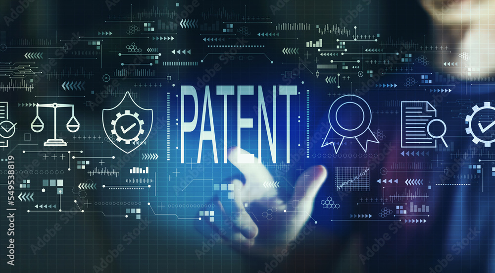 Patent concept with young man touching a digital screen at night Patent concept with young man touching a digital screen at night
