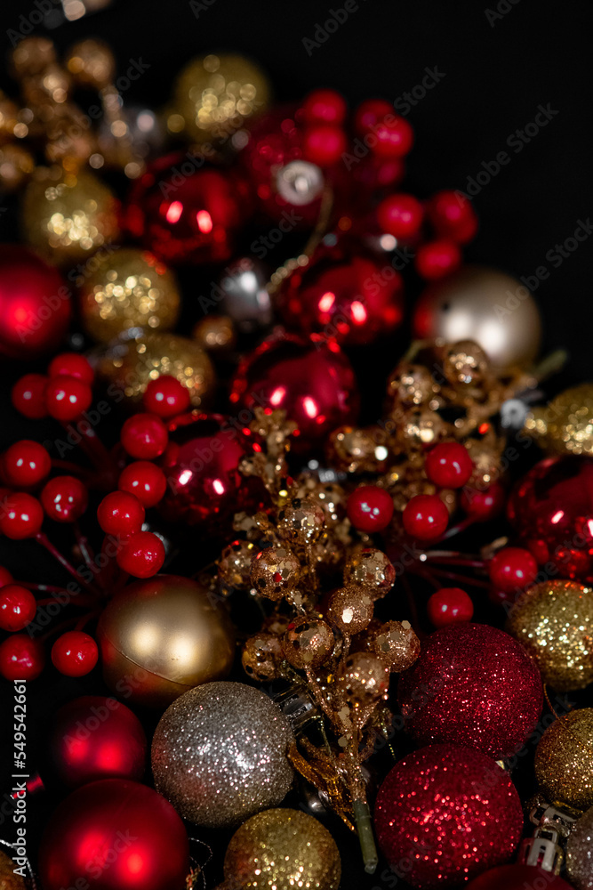 red and gold christmas toys on black background red and gold christmas toys on black background