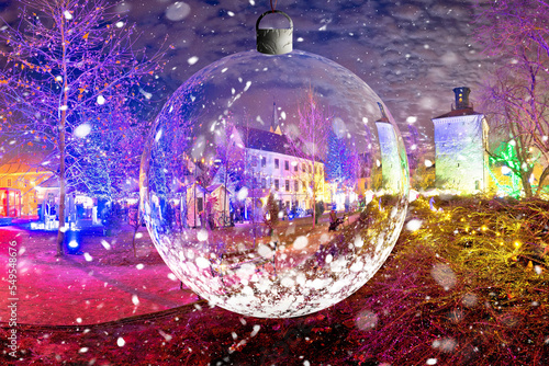 Fototapeta Naklejka Na Ścianę i Meble -  Zagreb historic upper town advent evening snow view through glass christmas ball