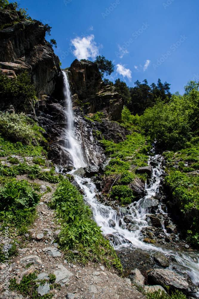 High beautiful waterfall on the Caucasus Mountains High beautiful waterfall on the Caucasus Mountains